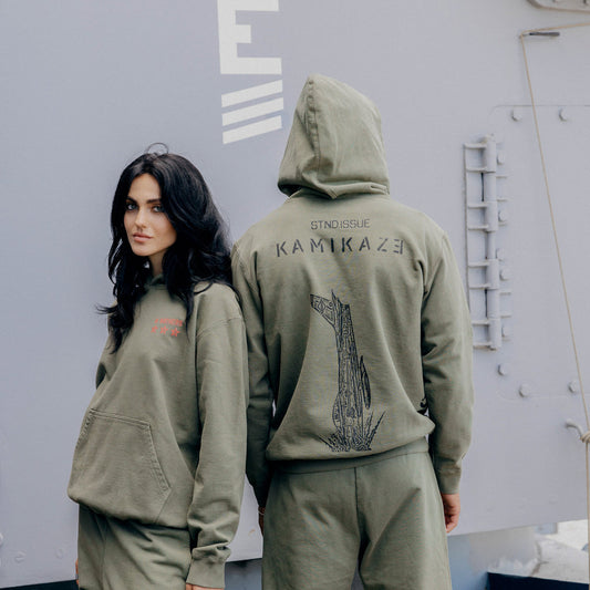 Back of the burnt olive Eminem Kamikaze Standard Issue hoodie with tonal bomb graphic