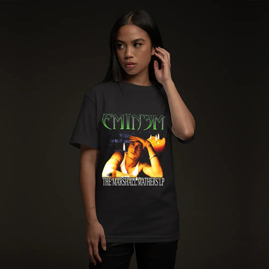 Woman wearing the black MMLP Eminem T-shirt, green Eminem logo above the album art