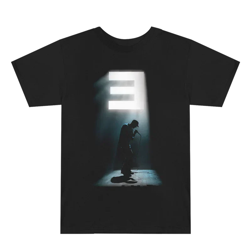 Black Eminem Stage Lights T-shirt flat lay with backlit E logo and stage silhouette print