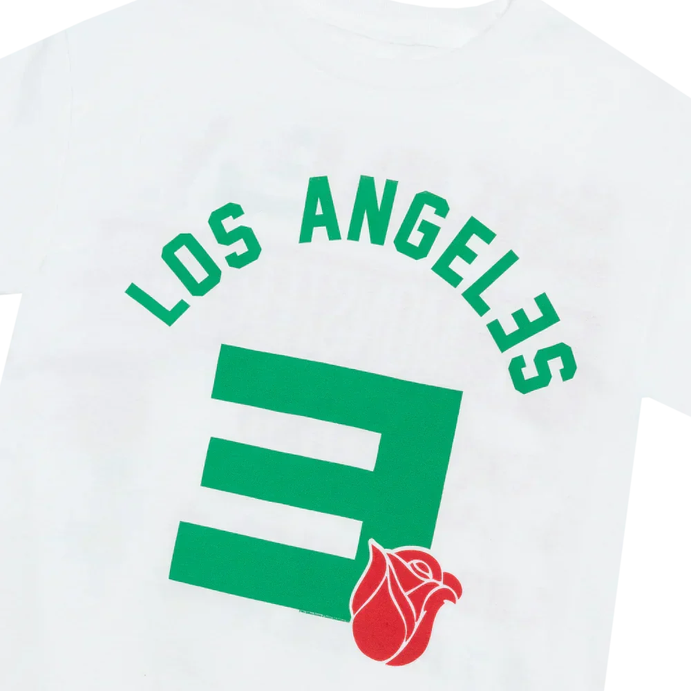 Close-up of the green Los Angeles and E logo print with red rose on the Eminem Rose Bowl T-shirt