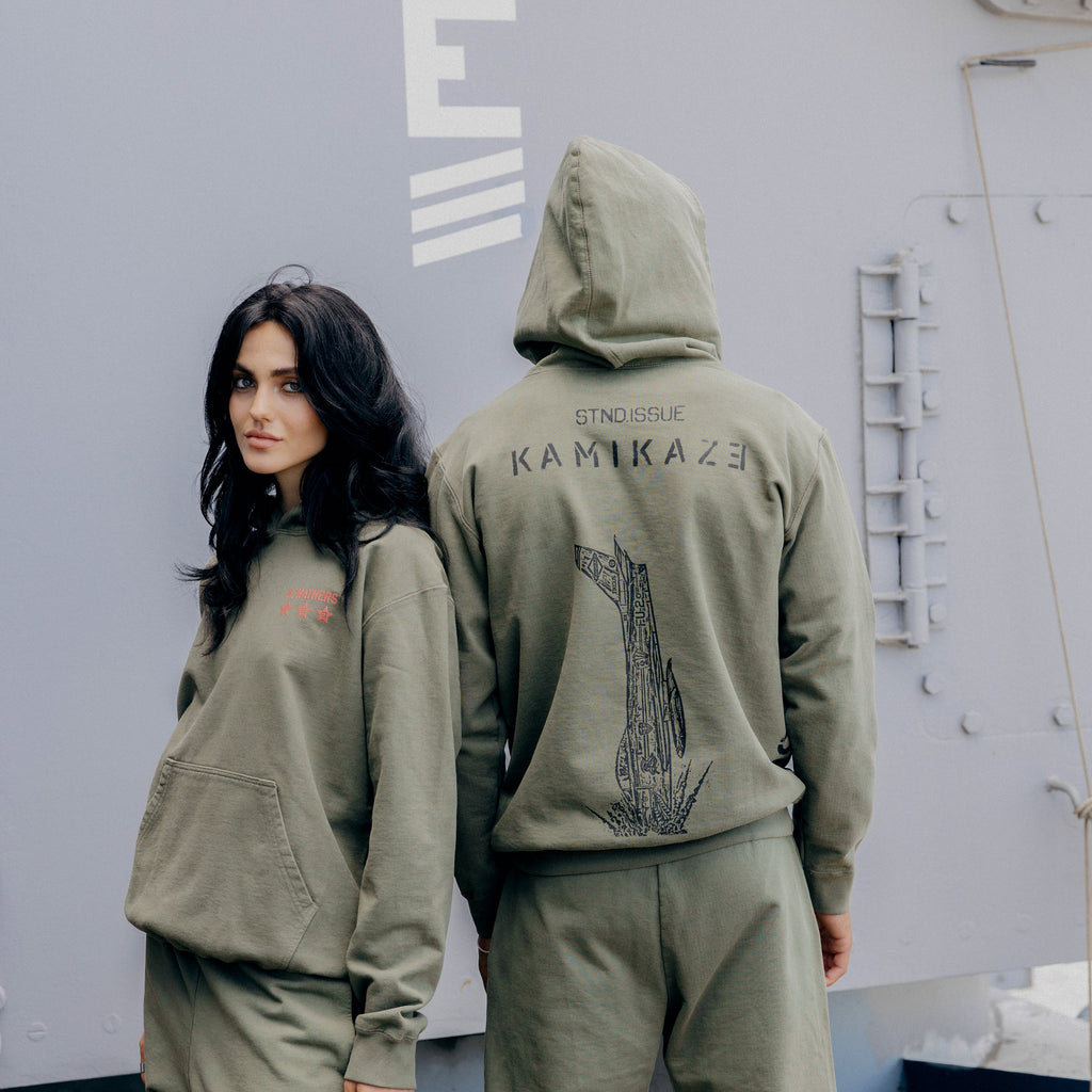 Back of the burnt olive Eminem Kamikaze Standard Issue hoodie with tonal bomb graphic