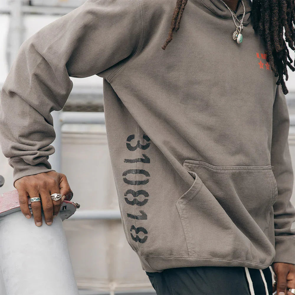 Sleeve print detail reading 310818 on the taupe Eminem Kamikaze hoodie