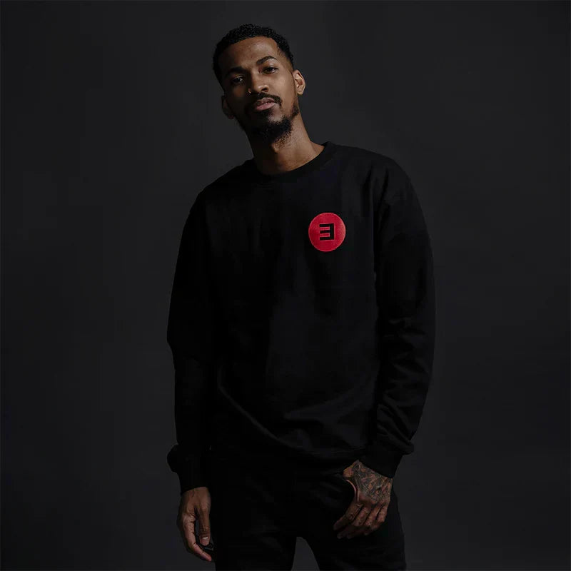 Man wearing the black Eminem Basic E Logo crewneck sweatshirt, small red E logo print