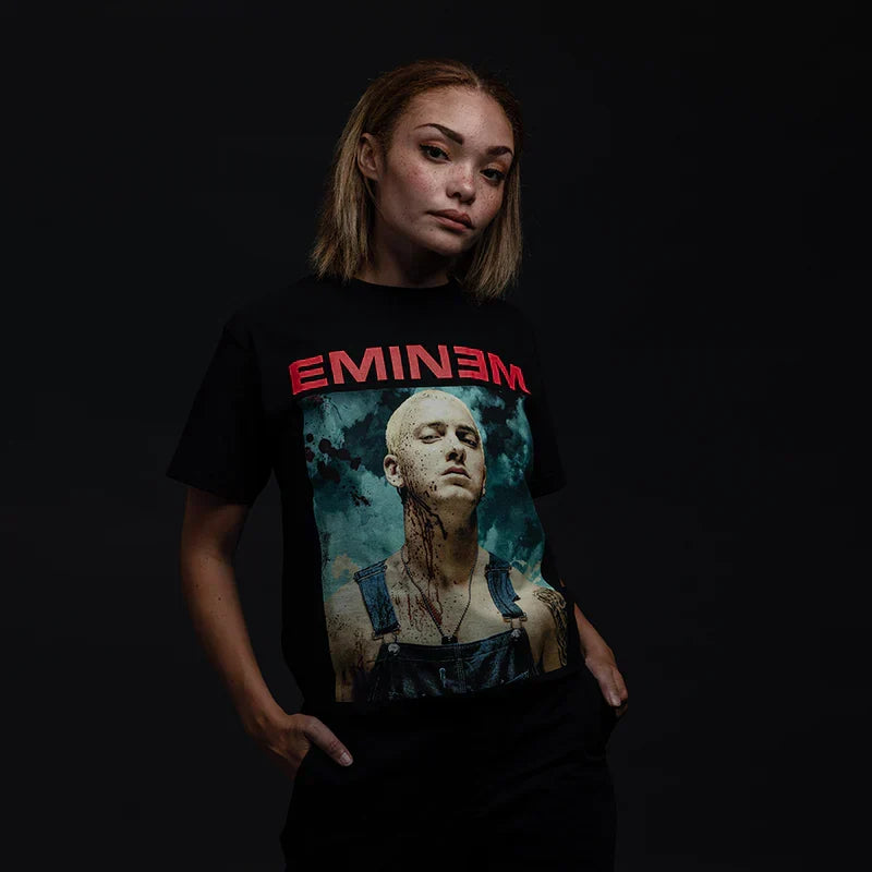 Woman wearing the black Eminem Bloody Chainsaw graphic T-shirt, red Eminem logo above the portrait