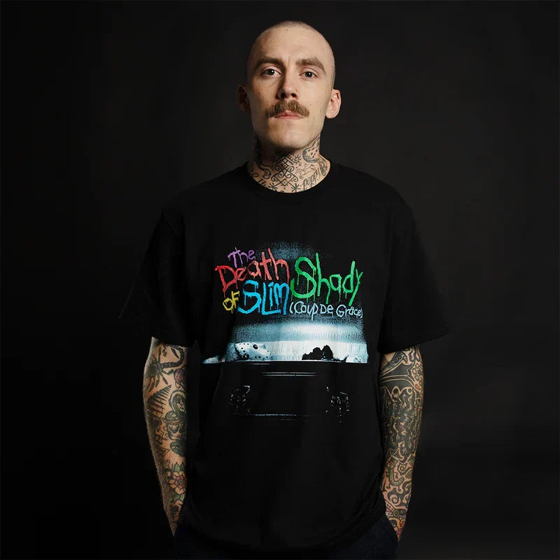 Man wearing the black Eminem TDOSS Chainsaw T-shirt with Death of Slim Shady artwork