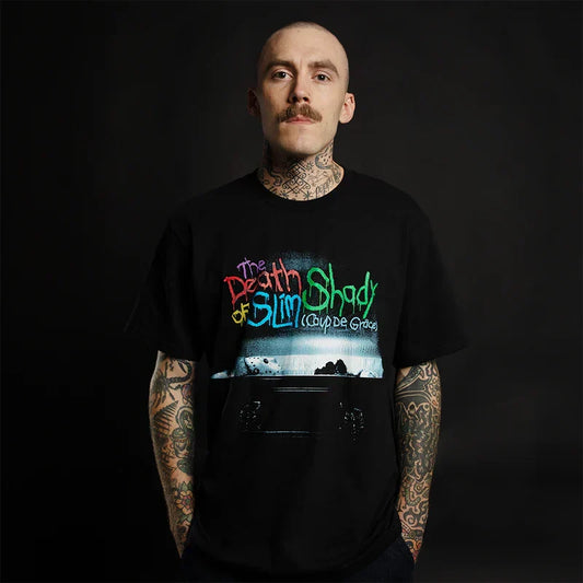 Man wearing the black Eminem TDOSS Chainsaw T-shirt with Death of Slim Shady artwork