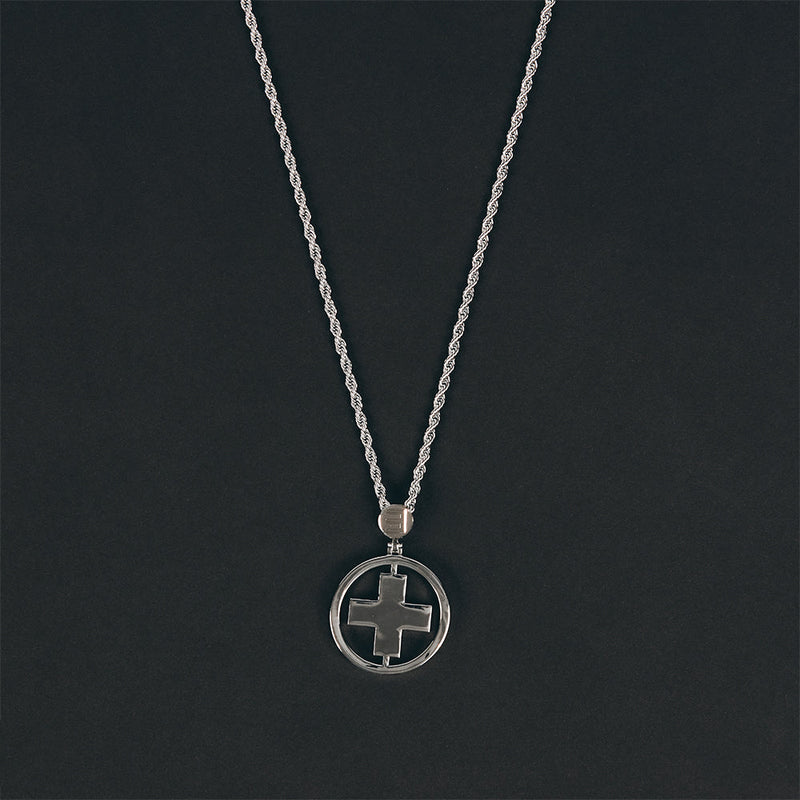 Close-up of the silver Eminem Recovery circular cross pendant on its chain