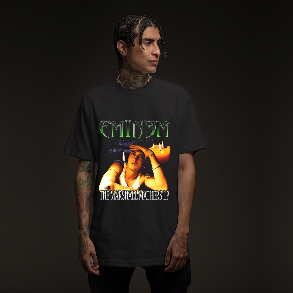 Man wearing the black MMLP Eminem T-shirt with green logo and Marshall Mathers LP artwork