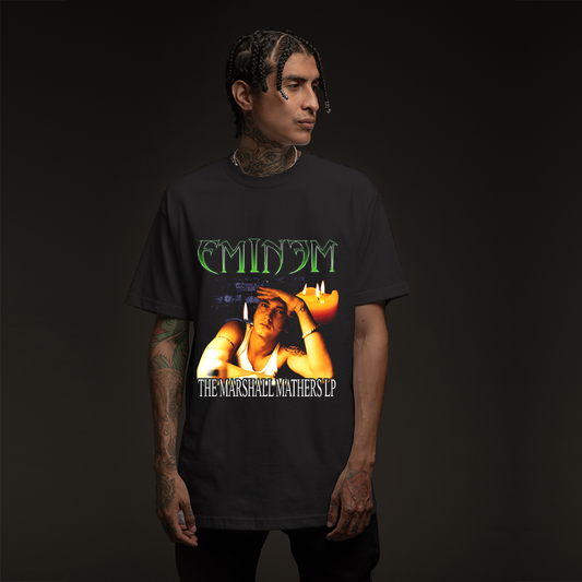 Man wearing the black MMLP Eminem T-shirt with green logo and Marshall Mathers LP artwork