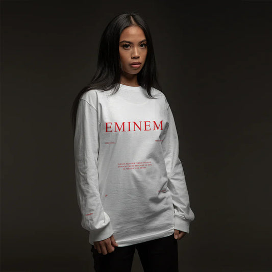 Woman wearing the white Eminem MMLP PSA long sleeve with red Eminem chest print