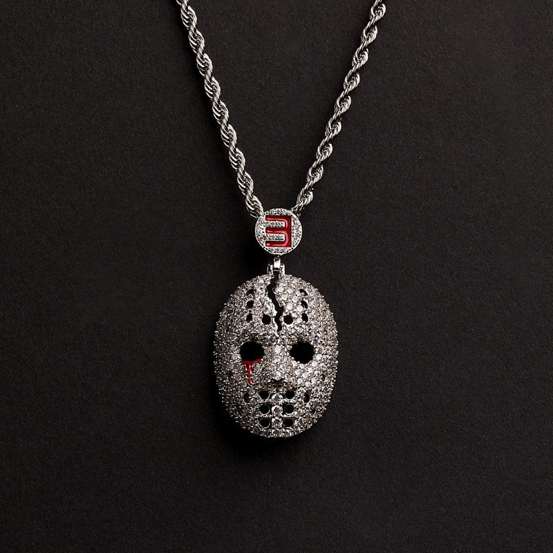 Eminem hockey mask diamond pendant on a silver rope chain against a black background