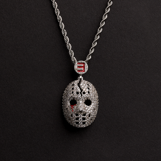 Eminem hockey mask diamond pendant on a silver rope chain against a black background