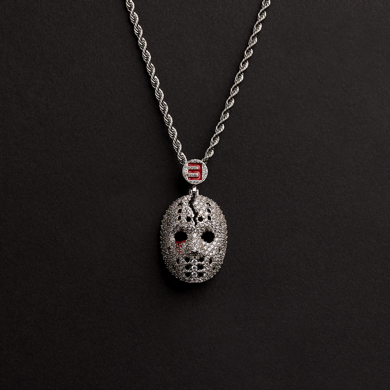 Close-up of the Eminem hockey mask diamond pendant with red stone eyes and E logo bail
