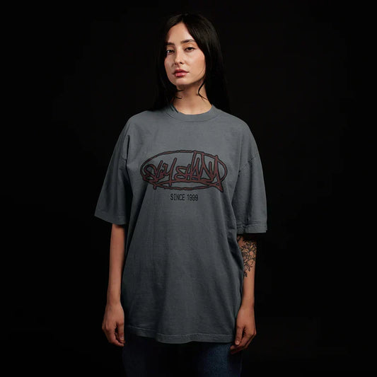 Woman wearing the grey Eminem Plz Stand T-shirt with red graffiti chest print