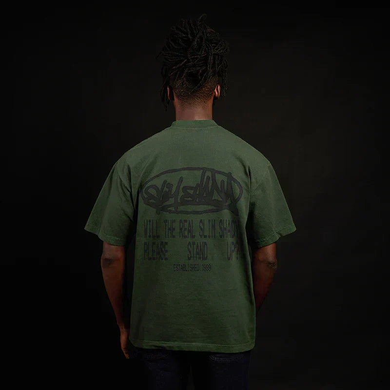 Back of the green Eminem Plz Stand T-shirt on a model, Will The Real Slim Shady print