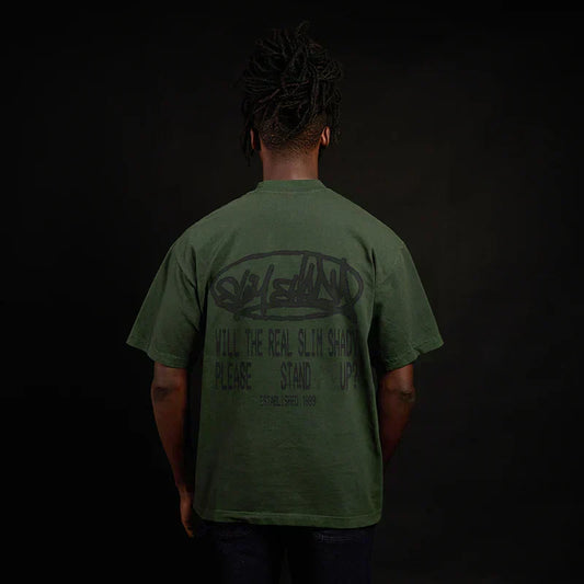 Back of the green Eminem Plz Stand T-shirt on a model, Will The Real Slim Shady print
