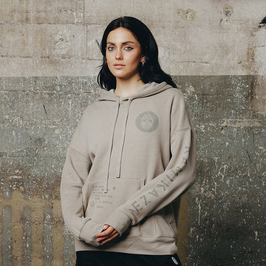 Woman wearing the grey Eminem Kamikaze Mask hoodie with tonal circular crest print