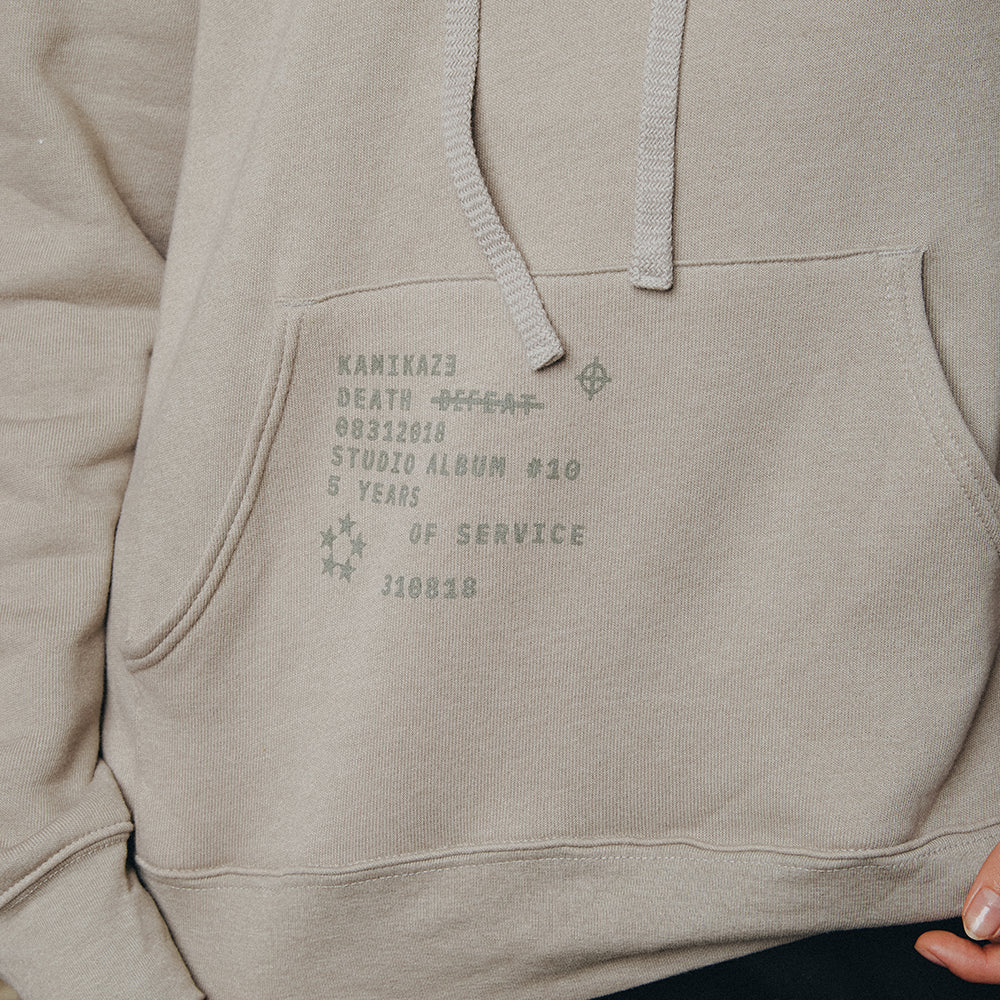 Print detail reading Kamikaze Death Before Defeat on the grey Eminem hoodie pocket