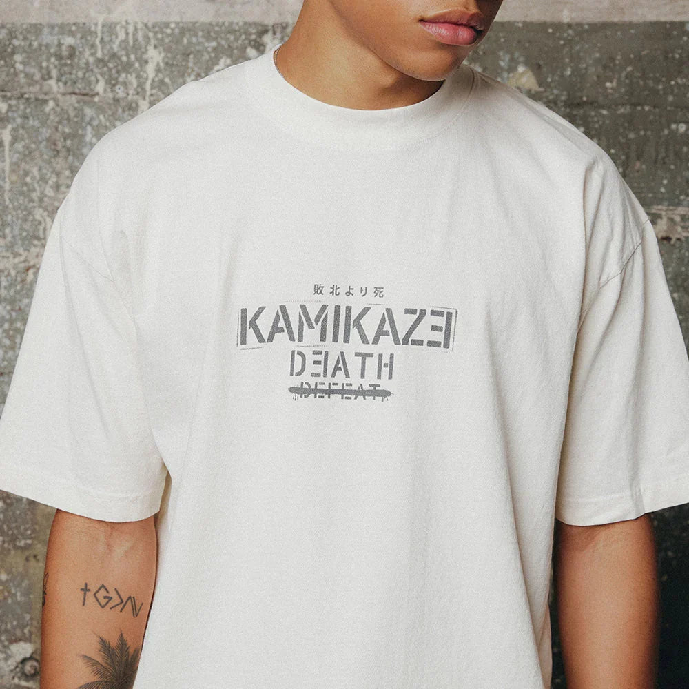 Close-up of the Kamikaze Death chest print on the cream Eminem Propaganda T-shirt