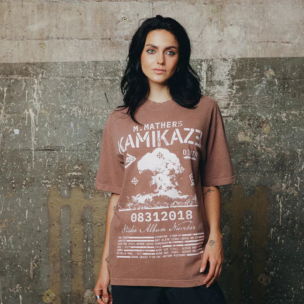 Woman wearing the rust red Eminem Kamikaze vintage album art T-shirt with track list print