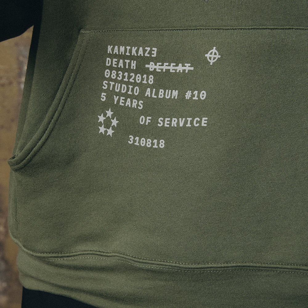 Print detail reading Kamikaze Death Before Defeat 08312018 on the Eminem hoodie pocket
