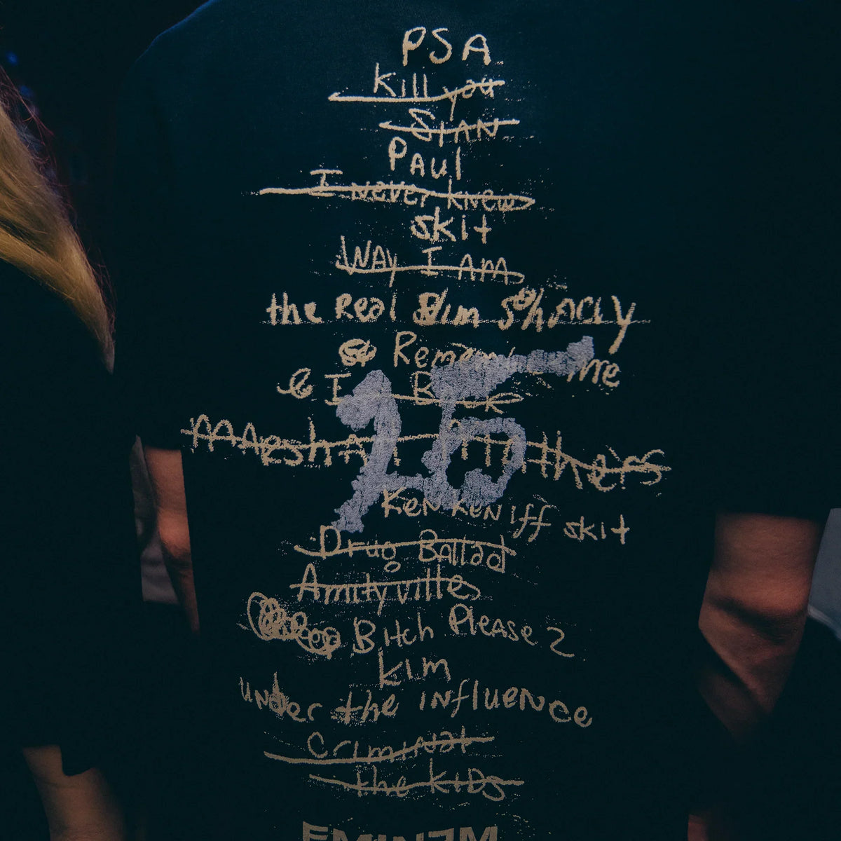 Back print detail of the Eminem MMLP25 Tracklist T-shirt with handwritten song titles