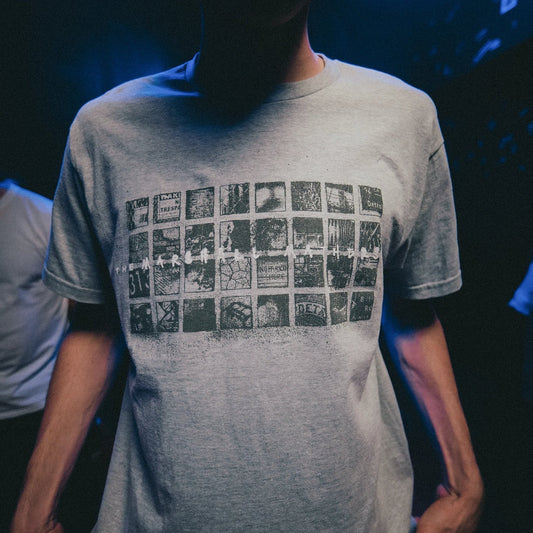 Close-up of the grey Eminem MMLP25 Scribble T-shirt with photo contact-sheet print