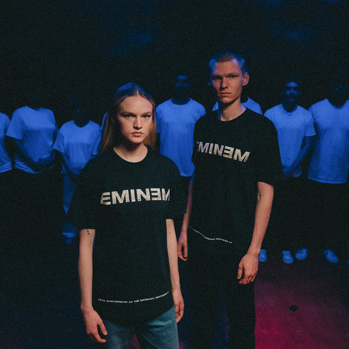 Two models wearing black Eminem MMLP25 Remember Me T-shirts with dripping script back print