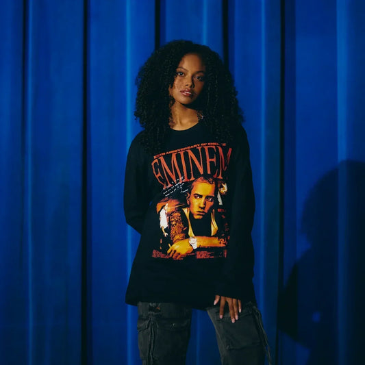 Woman wearing the black Eminem Encore 20th Anniversary long sleeve with red logo print