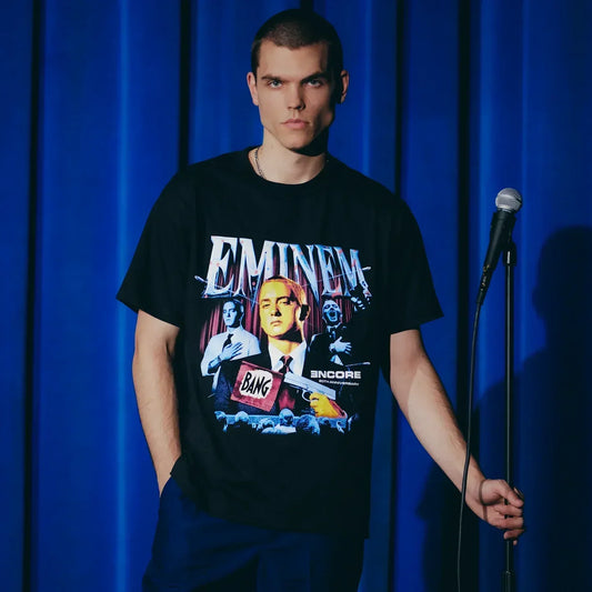 Man wearing the black Eminem Encore 20th Bang Flag T-shirt with collage photo print