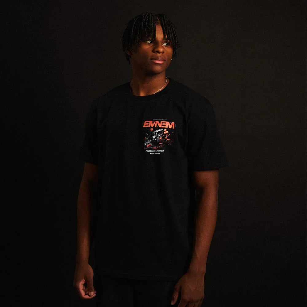 Man wearing the black Eminem Shady Gaming Chainsaw T-shirt with small chest print