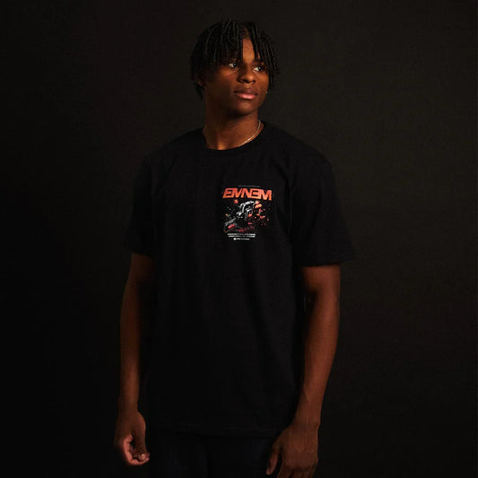 Man wearing the black Eminem Shady Gaming Chainsaw T-shirt with small chest print