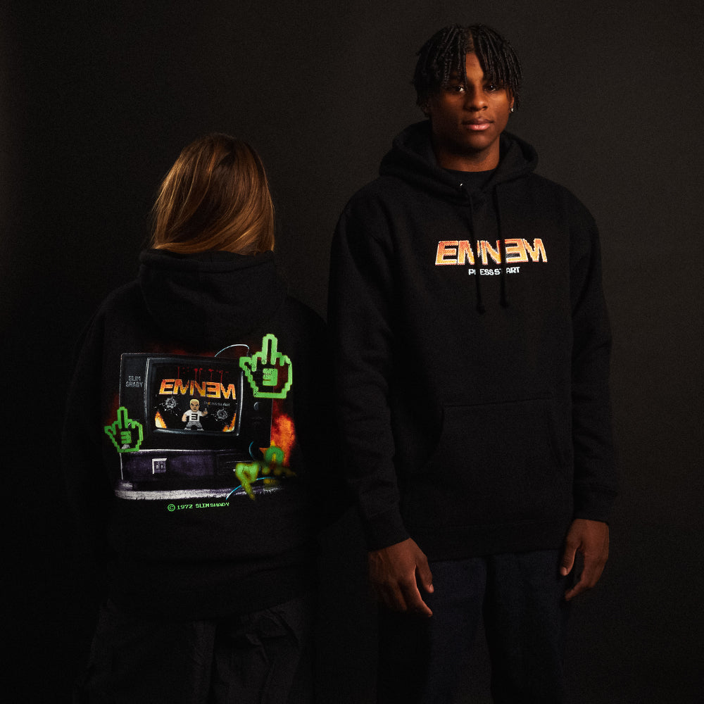 Two models in black Eminem Shady Gaming TV hoodies with green and orange graphics