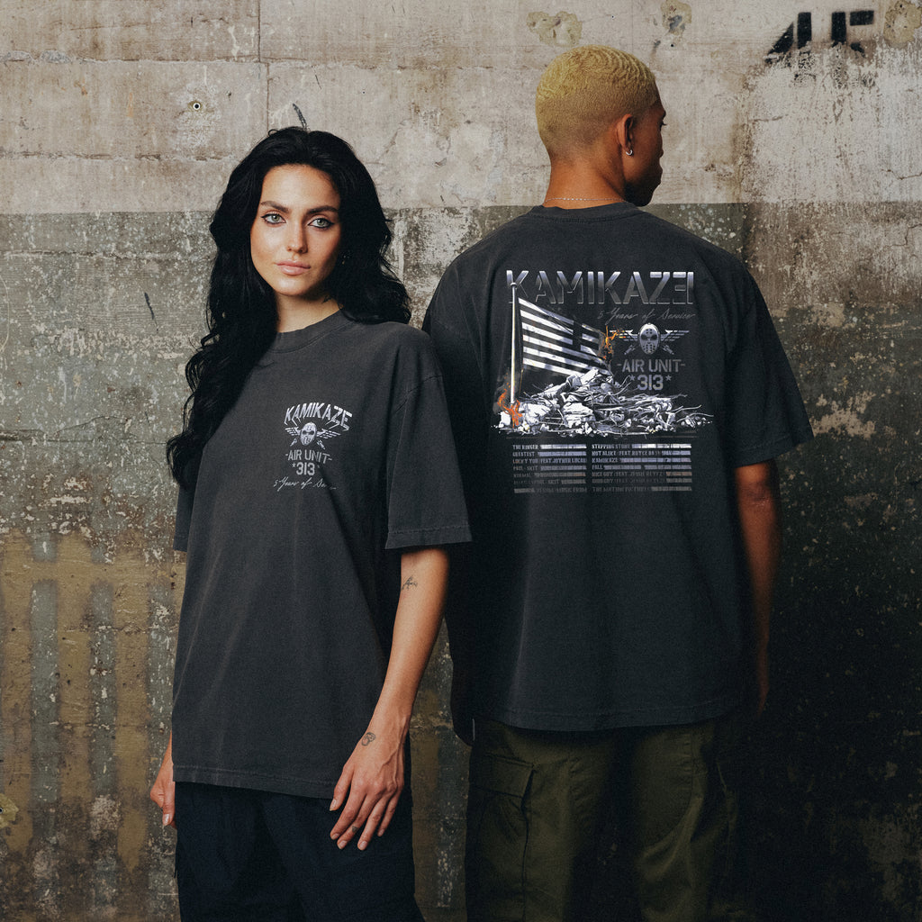 Eminem Kamikaze Flag T-shirts worn by two models showing front crest and back flag print