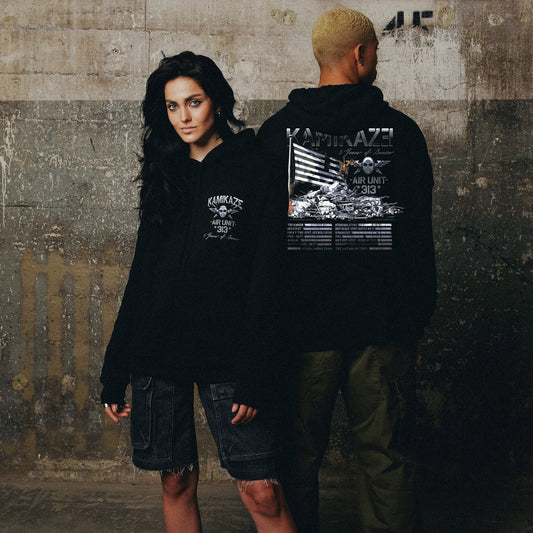 Two models in black Eminem Kamikaze Flag hoodies with white plane graphic back prints