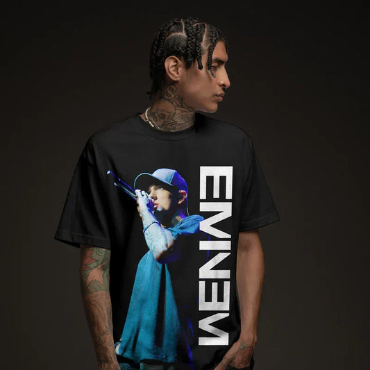 Man wearing the black Eminem On The Mic photo T-shirt with vertical white Eminem logo