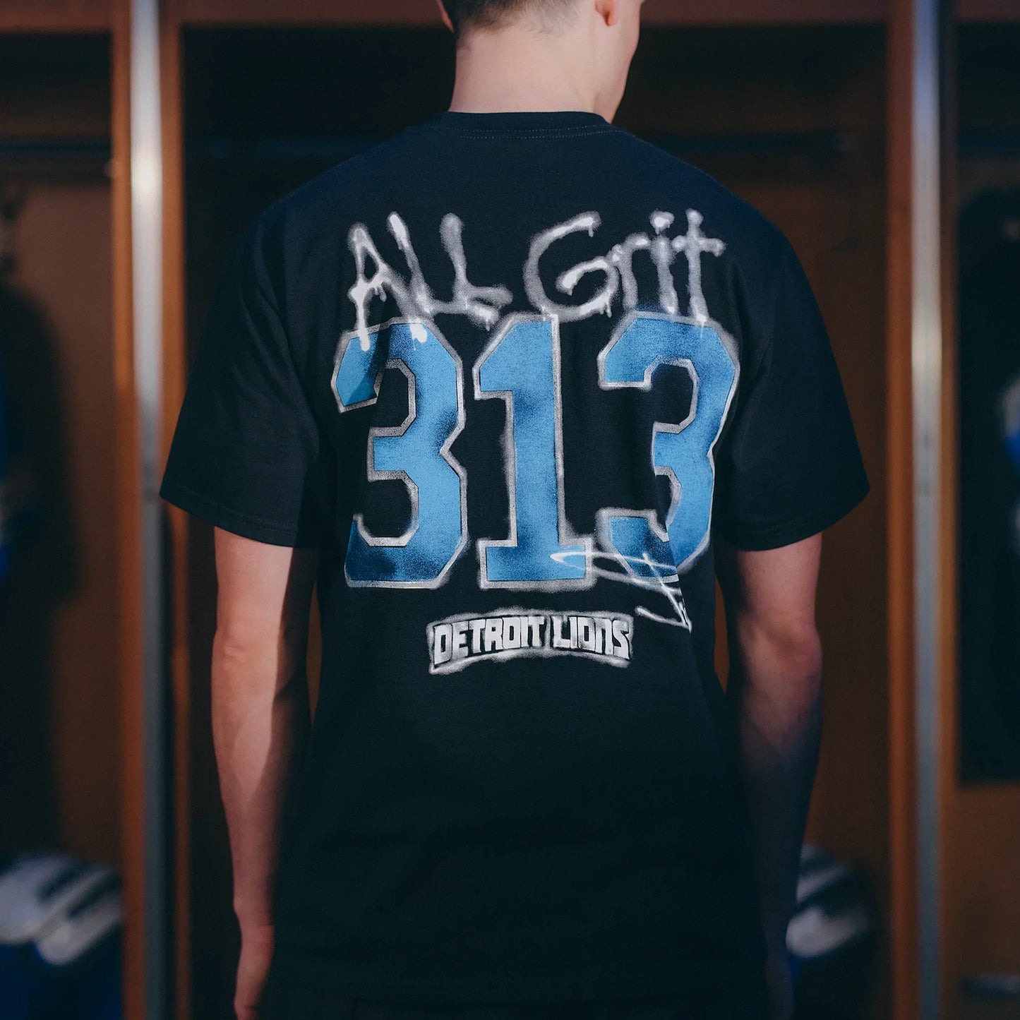 Back print detail: All Grit 313 Detroit Lions on the black Eminem collaboration T-shirt