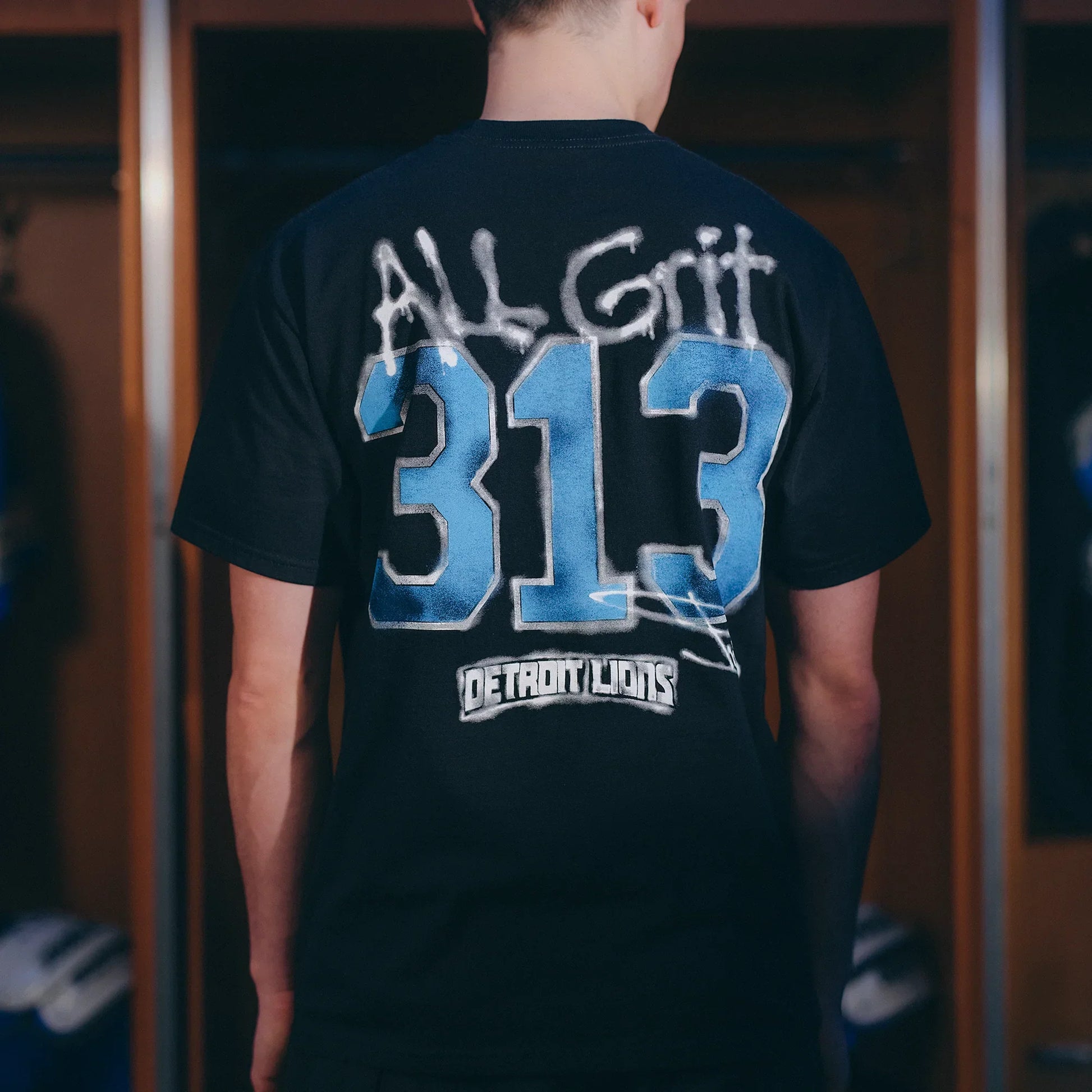 Back print detail: All Grit 313 Detroit Lions on the black Eminem collaboration T-shirt