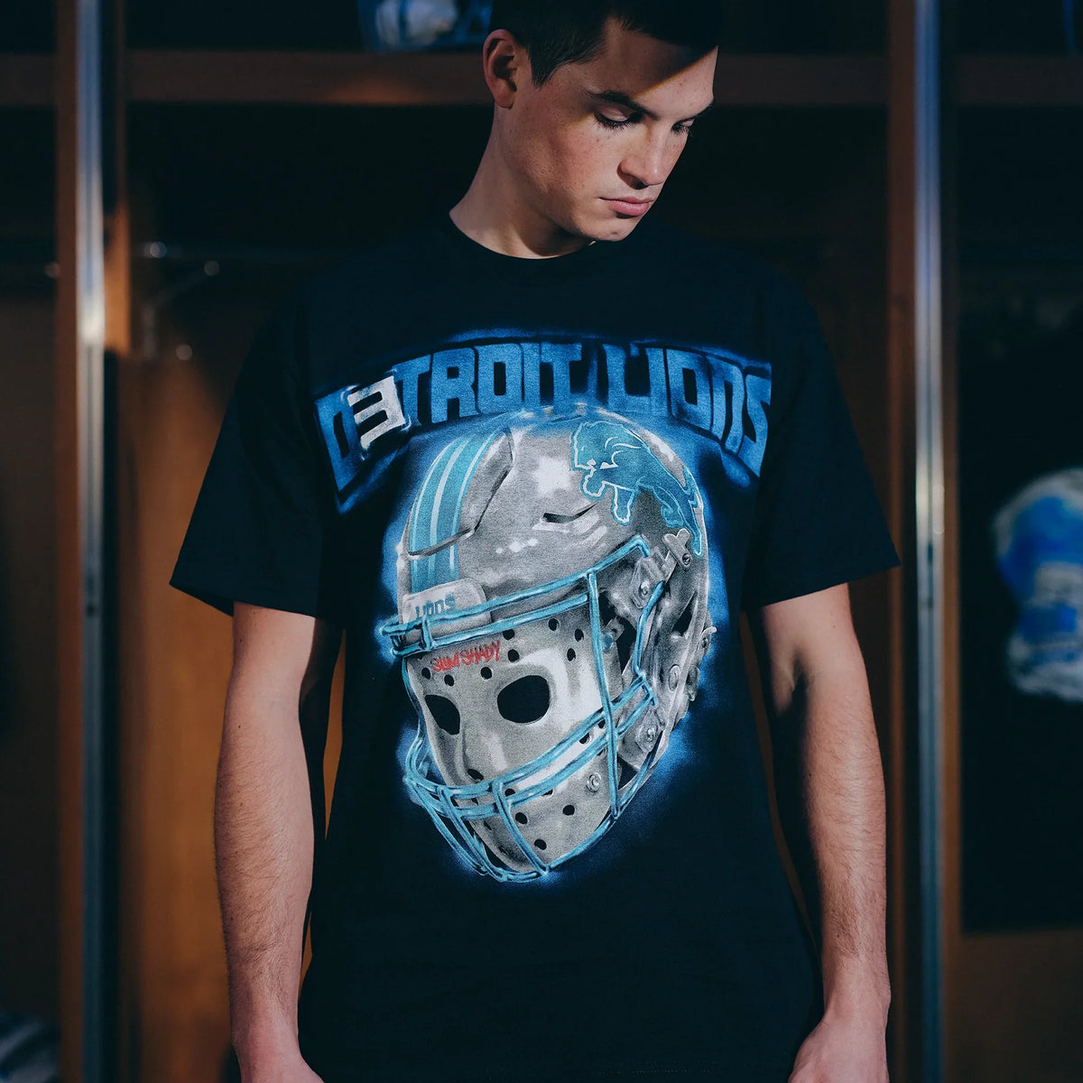 Close-up of the Eminem x Detroit Lions All Grit T-shirt chrome helmet chest graphic