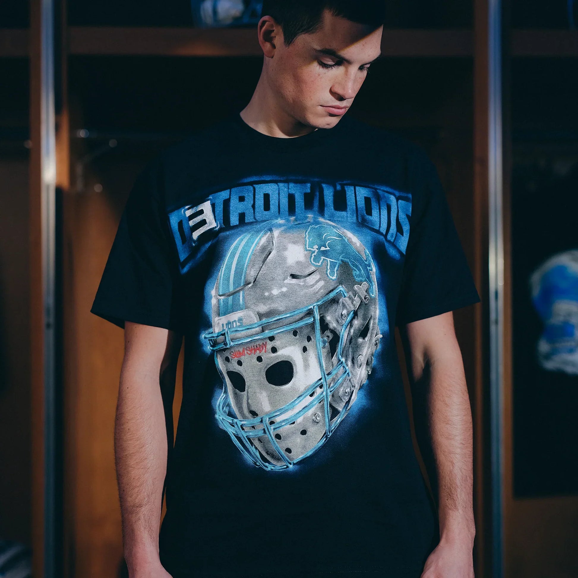 Close-up of the Eminem x Detroit Lions All Grit T-shirt chrome helmet chest graphic