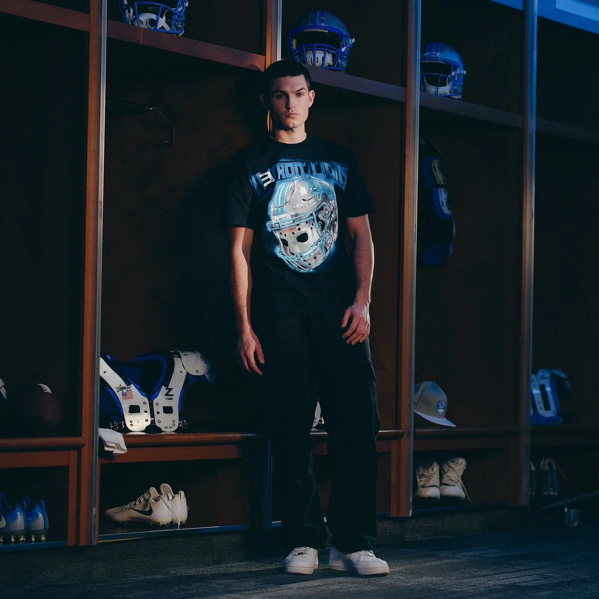 Full-length view of the black Eminem x Detroit Lions All Grit T-shirt on a model