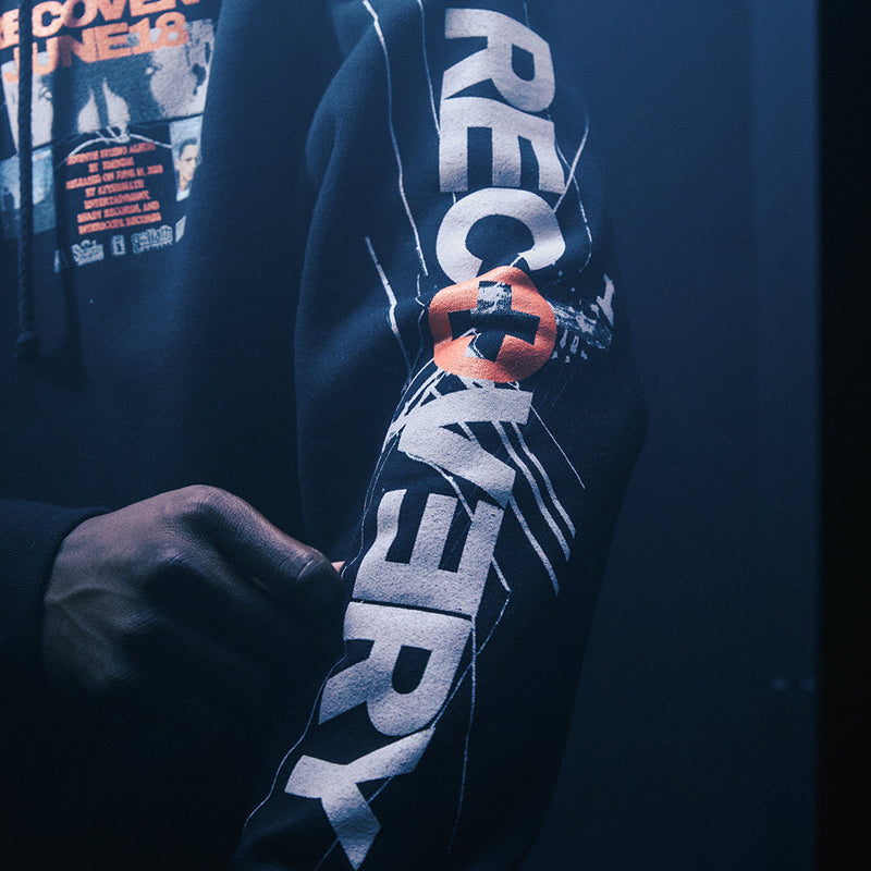 Sleeve print detail reading Recovery on the black Eminem Anniversary hoodie