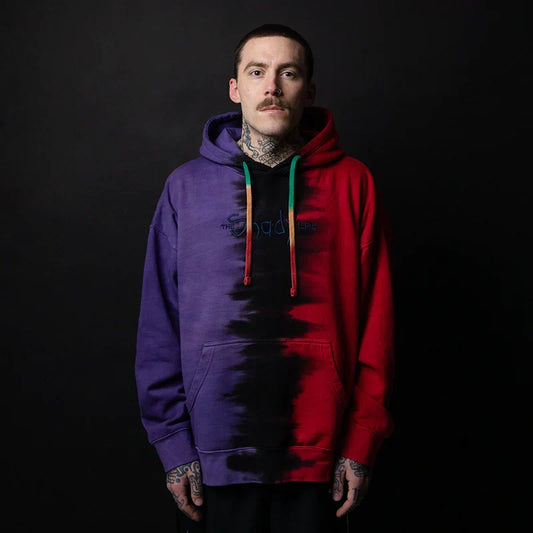 Man wearing the Eminem Shady LPs split dye hoodie in red and purple