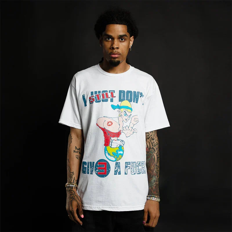 Man wearing the white Eminem TDOSS ISDGAF T-shirt with cartoon character graphic