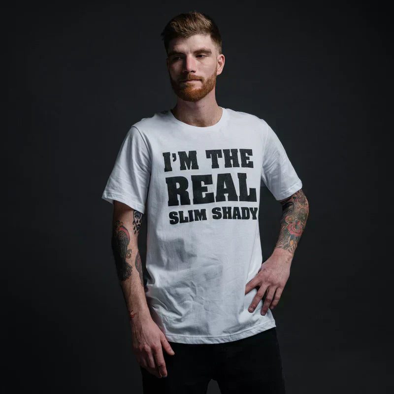 Man wearing the white Eminem I'm The Real Slim Shady T-shirt with black block lettering