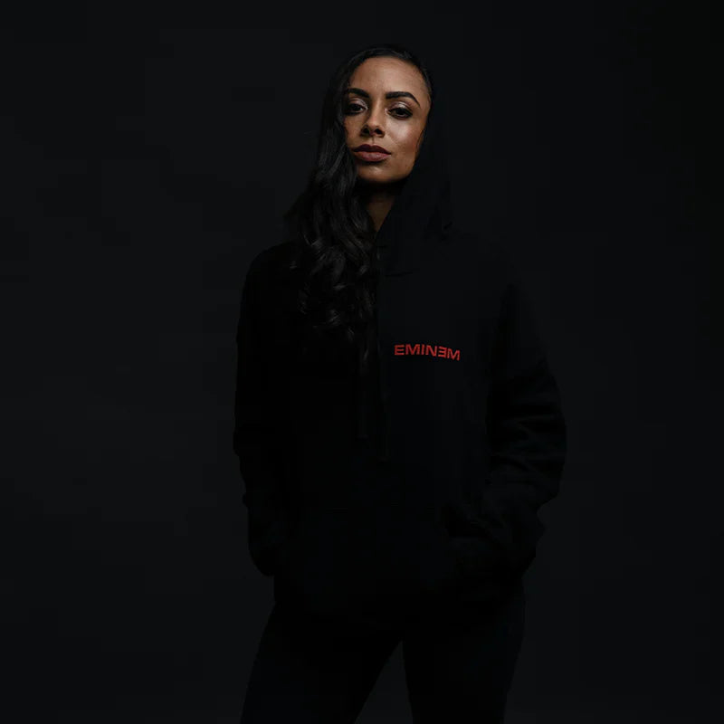 Woman wearing the black Eminem Orange Jumpsuit hoodie, front view