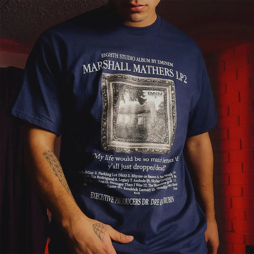 Close-up of the navy Eminem MMLP2 album T-shirt print with house photo and lyric line