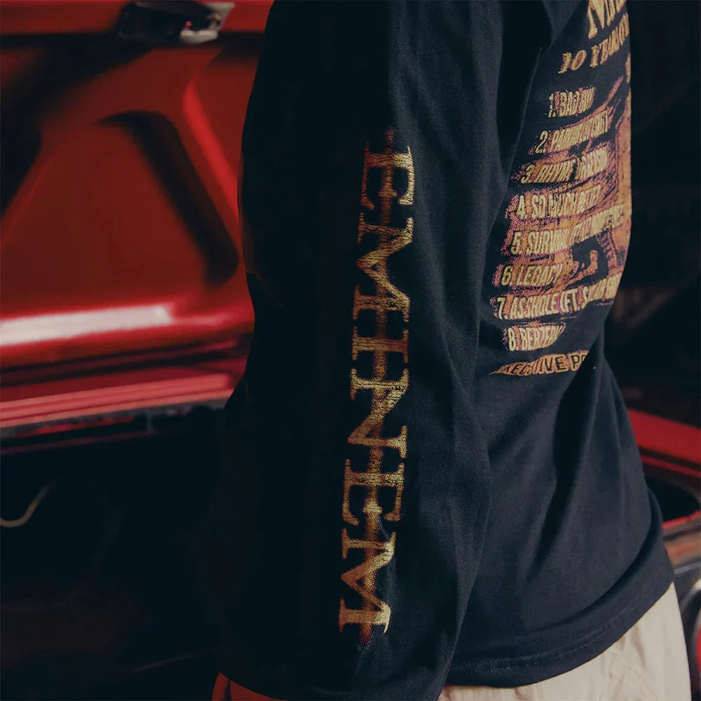 Sleeve print detail reading Eminem in gold on the black MMLP2 Horns long sleeve