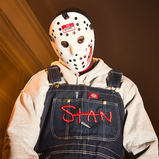 Eminem Hi! My Name Is hockey mask worn with Stan overalls in a styled portrait