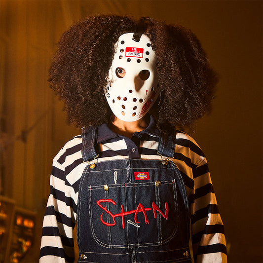 Model wearing the Eminem Hi! My Name Is hockey mask with red name tag sticker